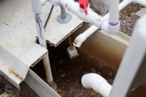 A view into the tank for a residential sump pump.