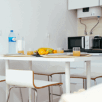 Bright kitchen breakfast table with fruit and drinks